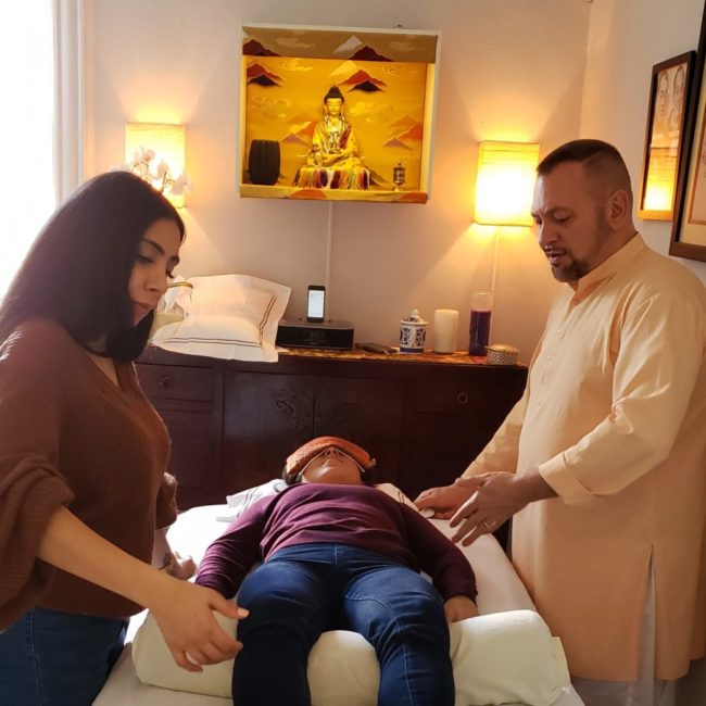 20190203_214347-3-1024×1024 Photo of Brian Brunius teaching a student in the Certified Reiki Practitioner training program at NYC Reiki Center.