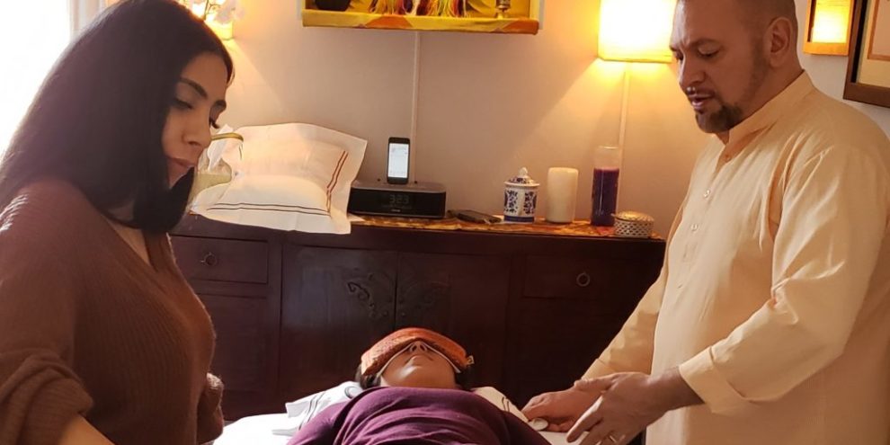 20190203_214347-3-1024×1024 Photo of Brian Brunius teaching a student in the Certified Reiki Practitioner training program at NYC Reiki Center.