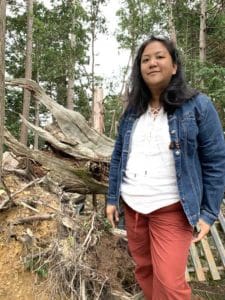 Photo of Diane Domondon on Mount Kurama with the roots of the Osugi Gongen visible behind her