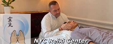 Photo of Brian Brunius giving a Reiki treatment at the NYC Reiki Center