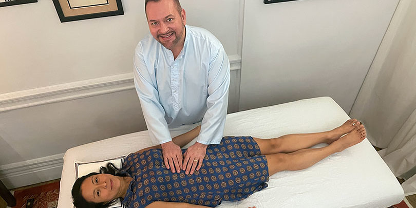 Brian Brunius giving Reiki to Racquel Borromeo on her Reiki Master initiation Day, May 22, 2022