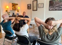 Photo of Brian Brunius teaching students in a private Reiki class at the NYC Reiki Center.