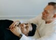 Photo of Brian Brunius giving a Reiki treatment to his most recent Reiki Master initiate, Amilyo Escobar.