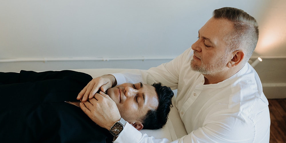 Brian-Brunius-giving-Reiki-Treatment Photo of Brian Brunius giving a Reiki treatment to his most recent Reiki Master initiate, Amilyo Escobar.