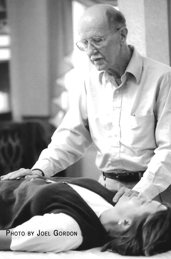 Photo of John Harvey Gray teaching a Reiki class around 2005.
