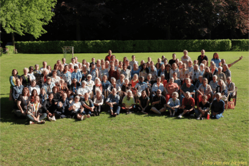 A group photo showing the many attendees of the Reiki Alliance 43rd annual conference at Biezenmortel, The Netherlands, in May 2025.