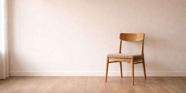Living-with-Reiki-Substack Living with Reiki - Substack image of a chair against a blank wall